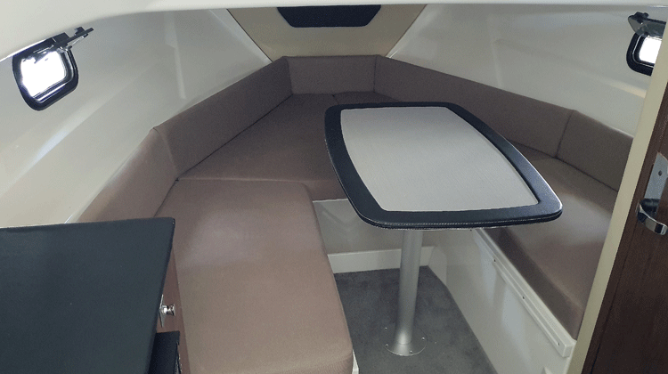 Roomy cabin with two adult berths and optional table movable to open cockpit